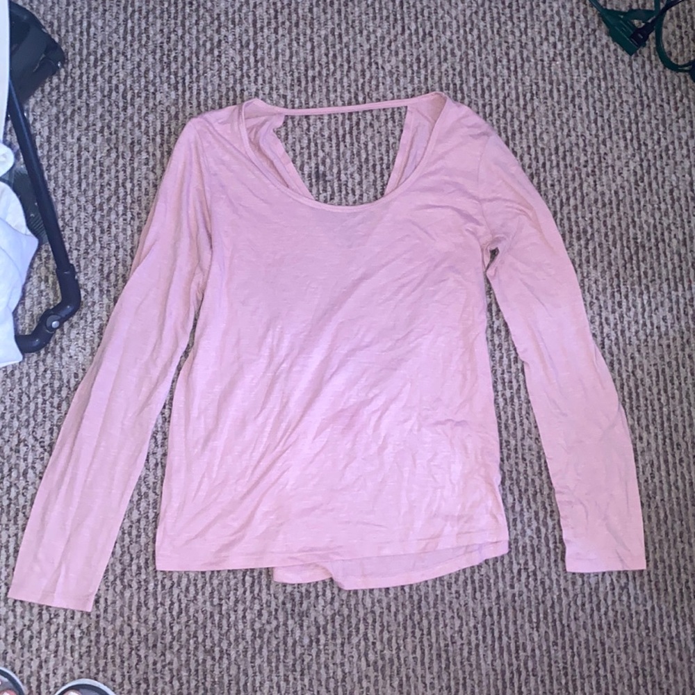 A long sleeve open middle back shirt. Unworn. Great condition.
